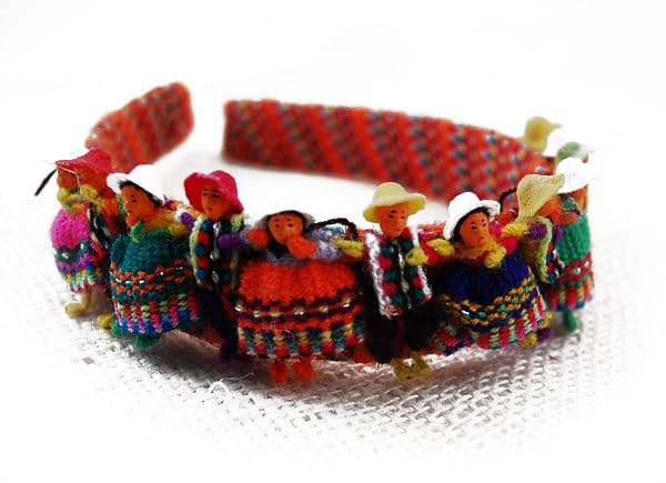 Colorful dolls on a headband covered in fabric