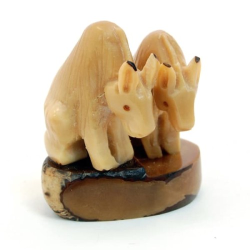 Two sitting donkeys hand carved and made out of tagua seeds.