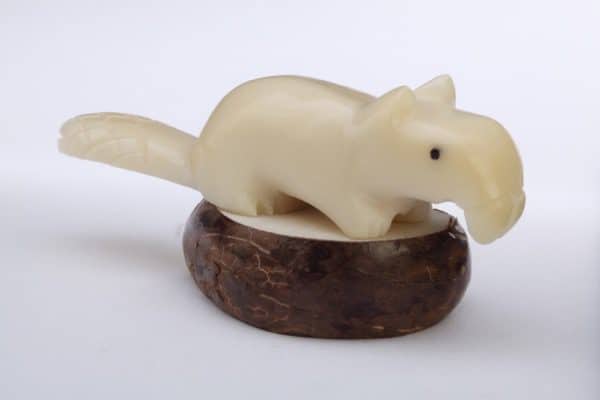 A beaver that has been carved with extreme detail in mind. these have been carved out of tagua nuts.