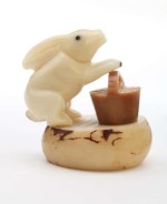 A bunny holding a basket, this was carved and assembled by hand