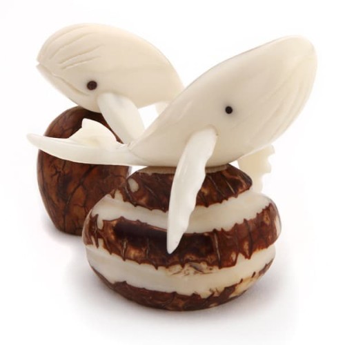 Two whales sitting on rocks, hand carved and made from tagua seeds