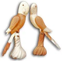 Two hand carved parrots made from tagua nuts