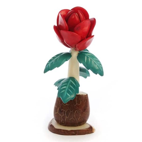 A hand carved flower made from tagua nuts.