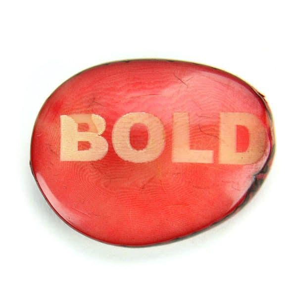 A tagua seed that says bold on it