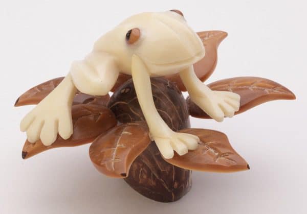 A frog sitting in a tree, these are hand carved and made from tagua nuts.
