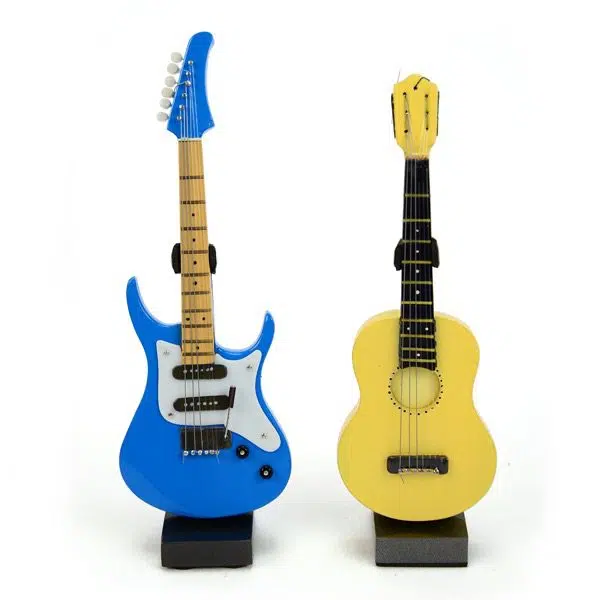 two different carved guitars next to each other, this picture has the blue and the yellow guitar next to each other