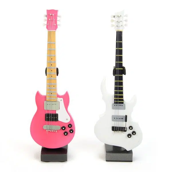 two different guitars the one on the left hand side is pink and the one on the right hand side is white