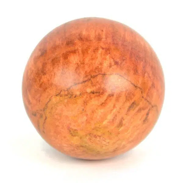 A highly polished orange jasper carved sphere