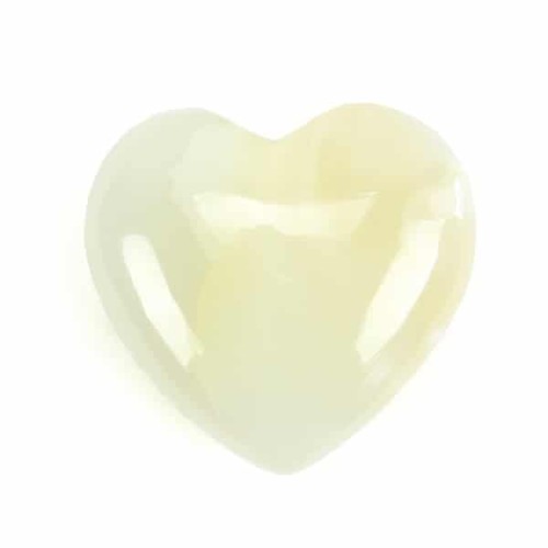 A highly polished white onyx carved heart