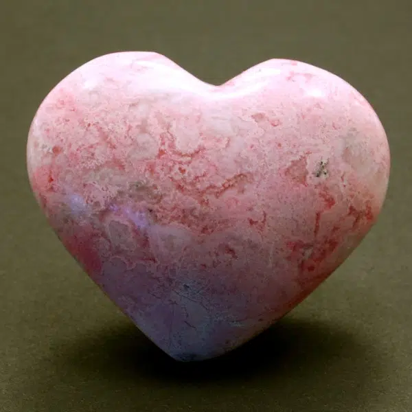 A highly polished rhodonite carved heart