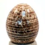 A highly polished aragonite carved egg