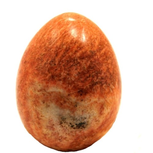 A highly polished orange jasper carved egg