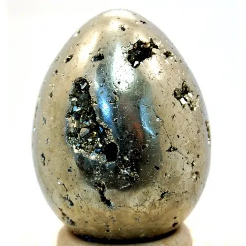 A highly polished pyrite carved egg