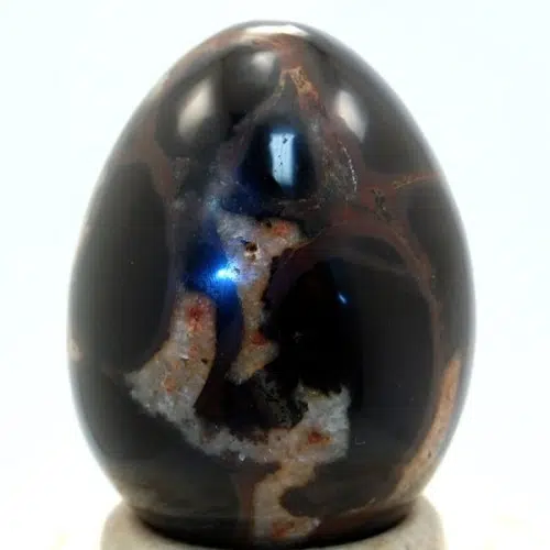 A highly polished septarian carved egg