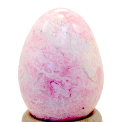 A highly polished rhodonite carved egg