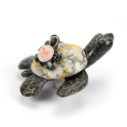 A pair of turtles made from marble that was mined in Ecuadors and hand carved.