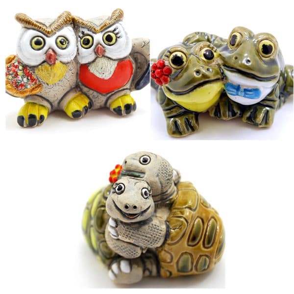 bundle of three different animals giving each other hugs, the three animals are, frogs, turtles, and owls.
