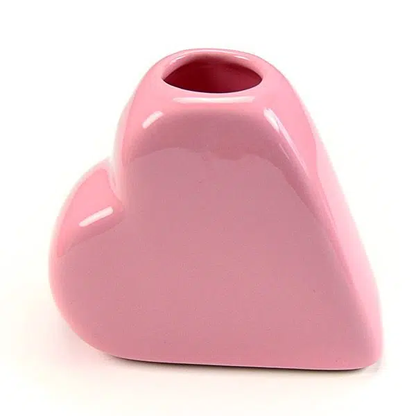 A small pink heart vase great for holding things