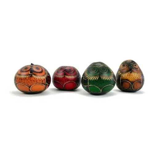 A picture of all the different colored gourd owl ornaments, coming in colors of orange, red, green, and brown.