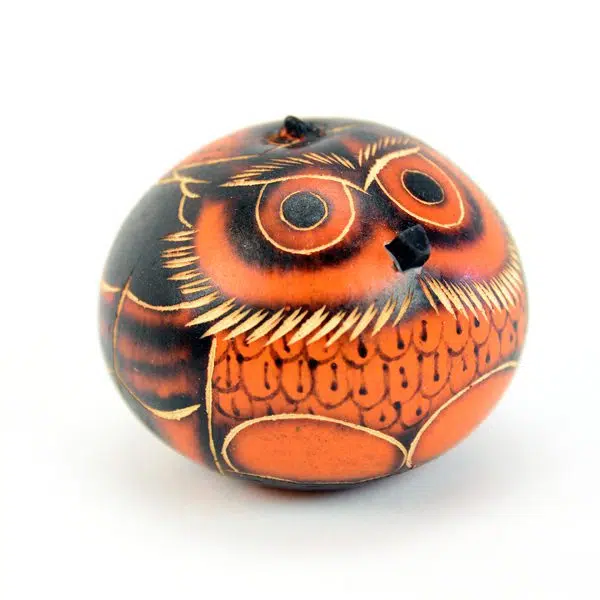 A close up of the orange gourd owl ornament