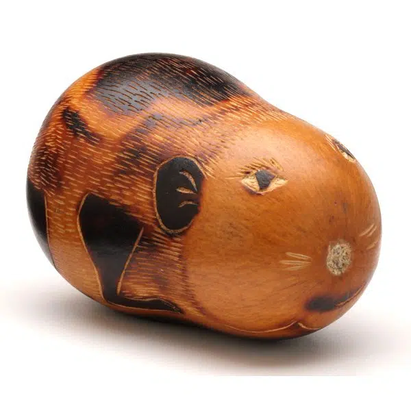 A gourd that has been carved to look like a hamster