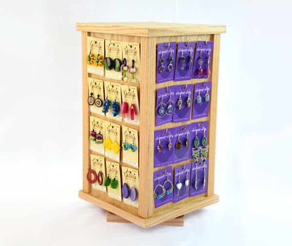 A four sided jewelry display that rotates