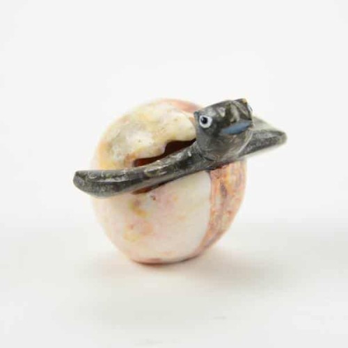 A turtle in an egg, sizes small, made from marble and is hand carved