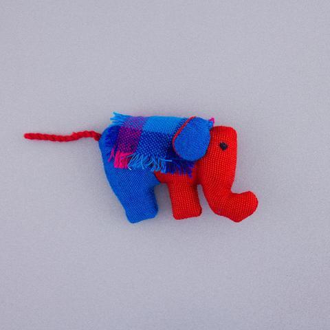 An elephant plush with a magnet, comes in a verity of colors, this one being red and blue