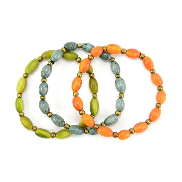 A close up picture of three different colors that the sofia bracelet can come in, those colors are, green, teal, and orange.