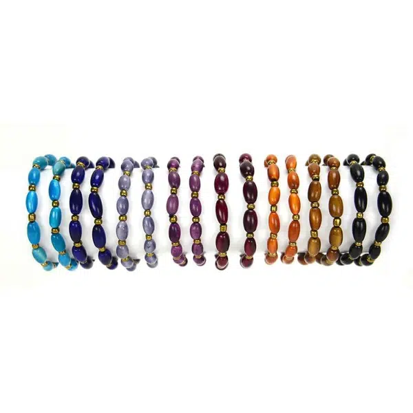 A picture of a wide verity of colors that the sofia bracelet can come in, those colors are turquoise, blue, light purple, purple, magenta, orange, brown, and black.