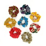 A bunch of different colored scrunchie with different design in a circle