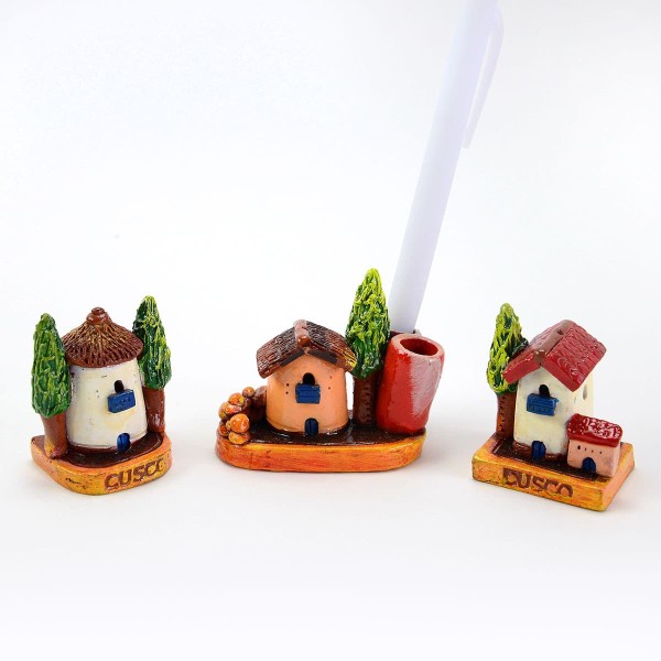 A picture of three miniature cusco houses, that can hold pens and pencils