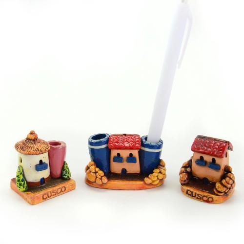 A picture of three miniature cusco houses, that can hold pens and pencils