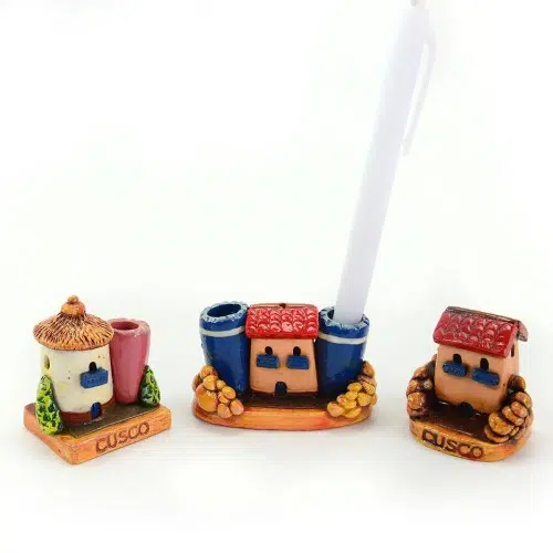 A picture of three miniature cusco houses, that can hold pens and pencils