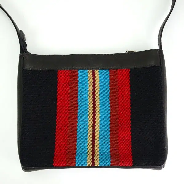 Black leather crossbody bag with black, red, blue and beige striped pattern