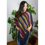 A young women wearing aurora alpaca poncho comes in more than one color