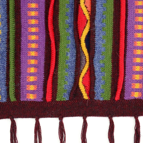 close up of the aurora alpaca poncho to show color and design, the color is red