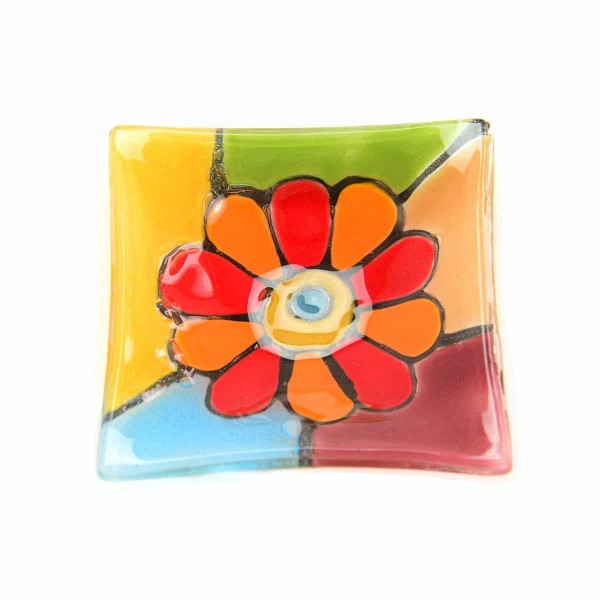 A close up shot of the flower fused glass dish.