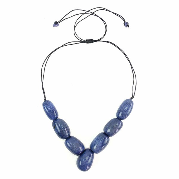 A picture of the siete tagua necklace, comes in a verity of colors. The color in this picture is blue.