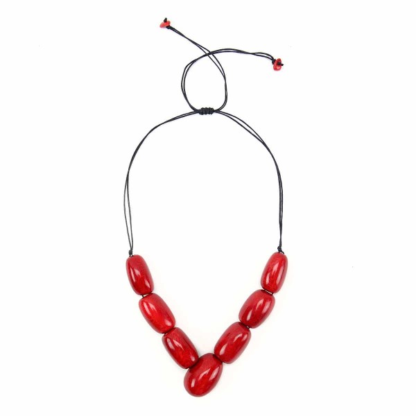 A picture of the siete tagua necklace, comes in a verity of colors. The color in this picture is red.