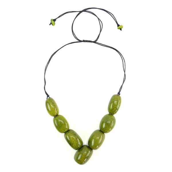 A picture of the siete tagua necklace, comes in a verity of colors. The color in this picture is green.