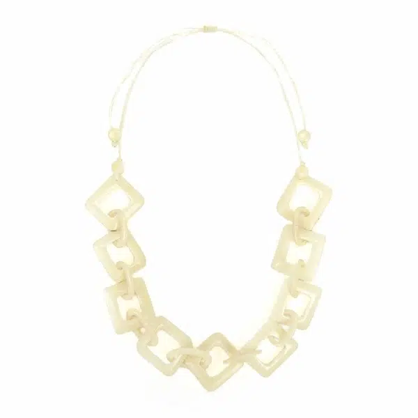 A close up picture of the white camille necklace.