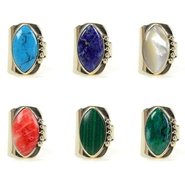 A picture of a bunch of different vessi ring, has a semi precious stone, the stone come in a verity of colors, those colors are, turquoise, blue, white, red, and green.