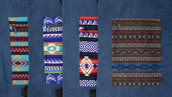 swatch of navy canvas bags in variety of tribal prints
