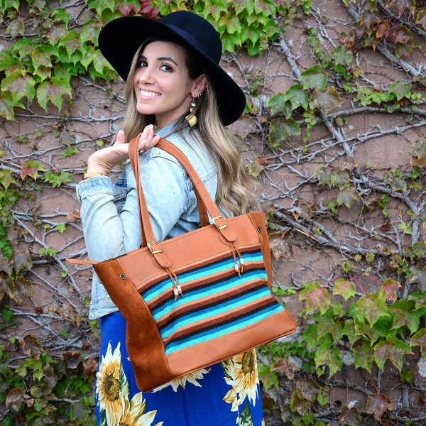 Girl showing Striped pattern design on back of Victoria Bag