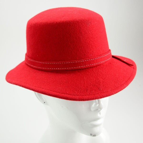 A red hat made from felt with a bowler and fedora style