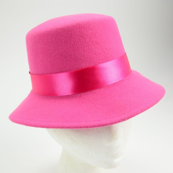 A pink hat made from felt with a bowler and fedora style