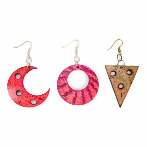 A picture of three different seed applique earrings, the styles are, half a moon, a circle with a hole in it, and a triangle with small holes in it.