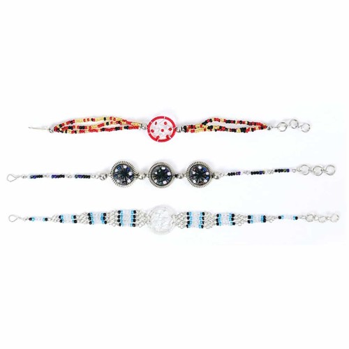 Three bracelets, all with different designs and colors, one bracelet is a bright blue, another bracelet is black with white, and the last bracelet is a bright red