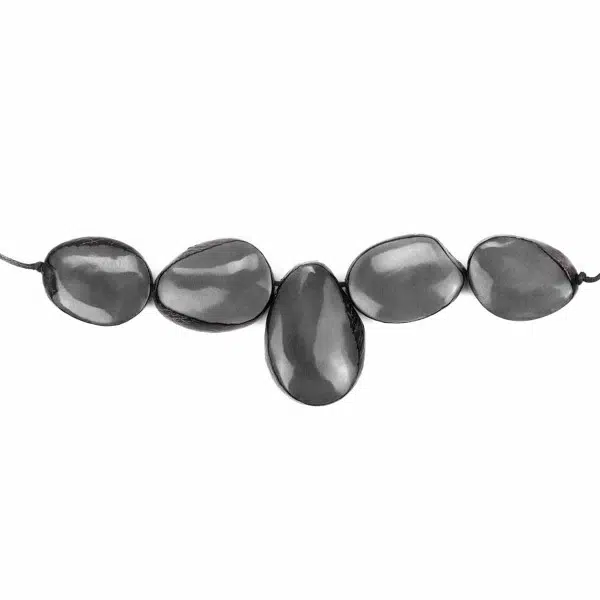 A picture of the grey cinco tagua necklace.